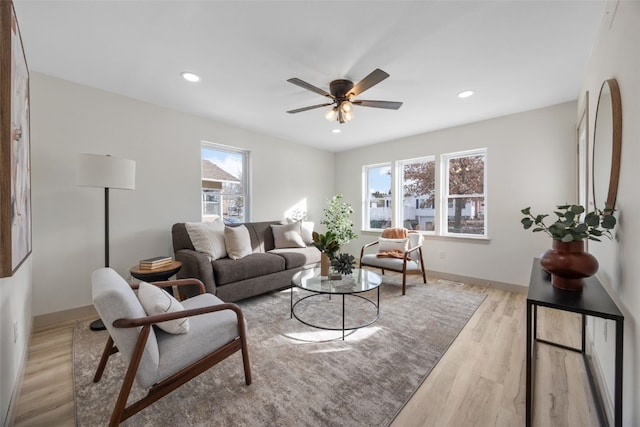 living area featuring ceiling fan, recessed lighting, baseboards, and light wood-style floors