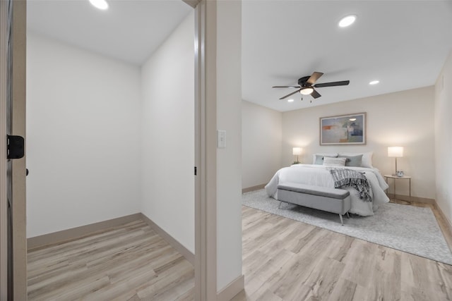 bedroom featuring baseboards, recessed lighting, a ceiling fan, and light wood-style floors