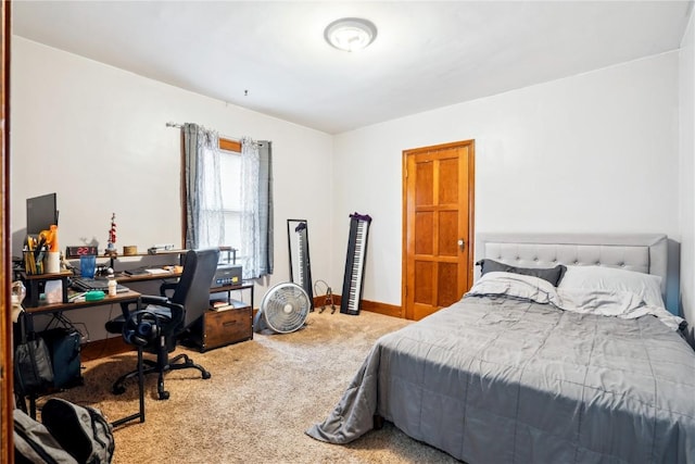 carpeted bedroom with baseboards