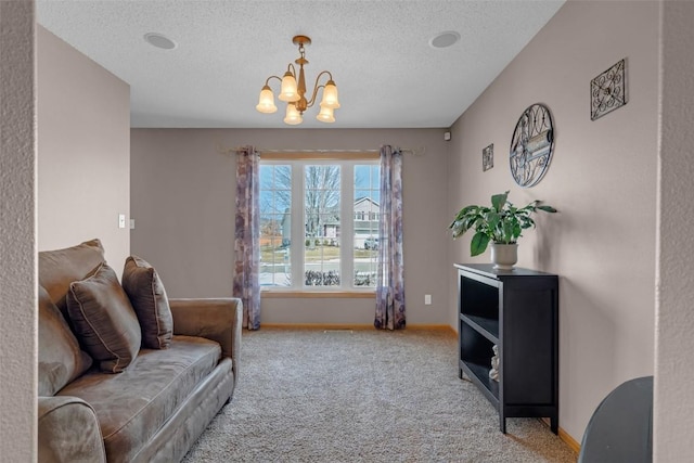 living area featuring a textured ceiling, baseboards, and carpet flooring