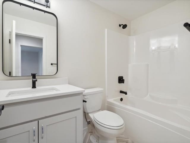 full bath with toilet, vanity, and bathing tub / shower combination