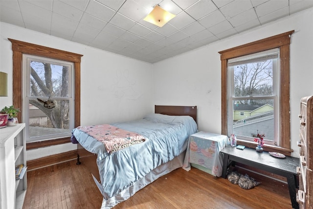 bedroom with wood-type flooring