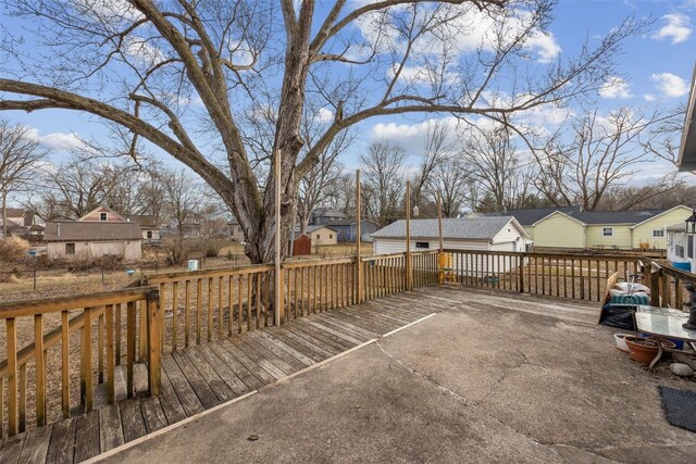 wooden terrace featuring a residential view