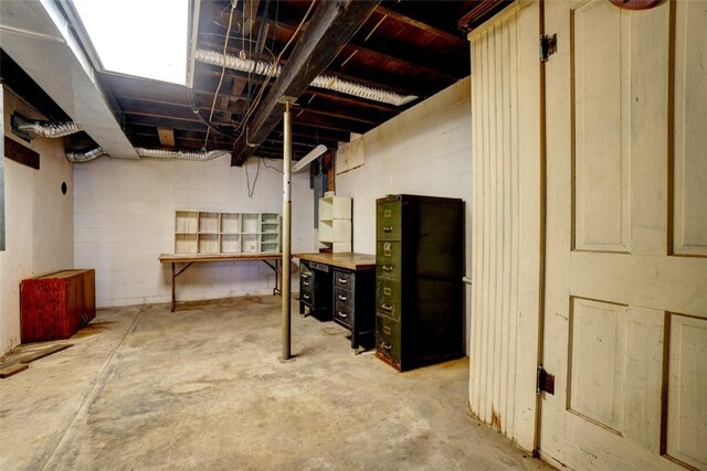 unfinished basement with concrete block wall