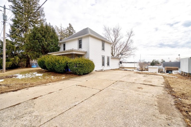 view of property exterior with driveway