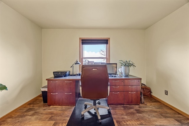 office area featuring dark wood finished floors and baseboards