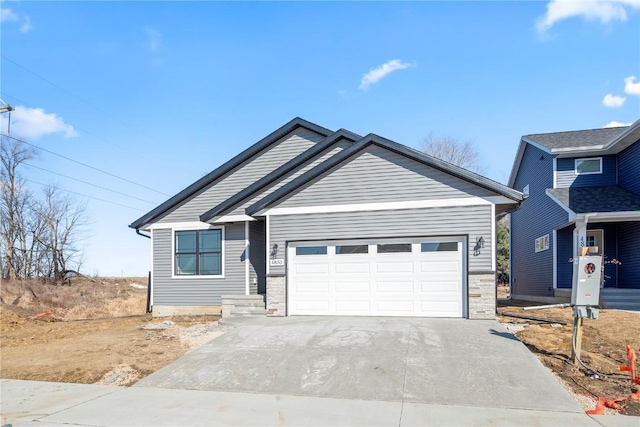 view of front of property featuring driveway and an attached garage