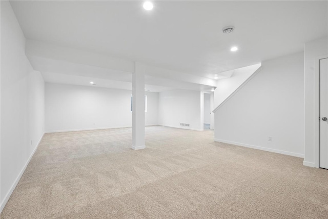 finished basement featuring baseboards, carpet floors, visible vents, and recessed lighting