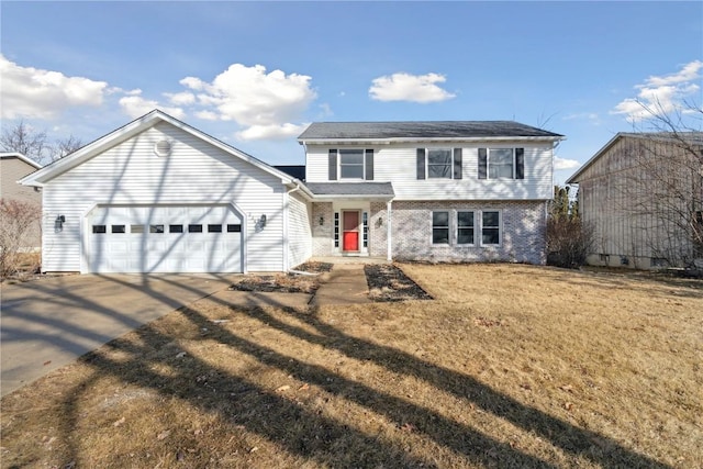 view of front of home featuring a front lawn, brick siding, a garage, and driveway