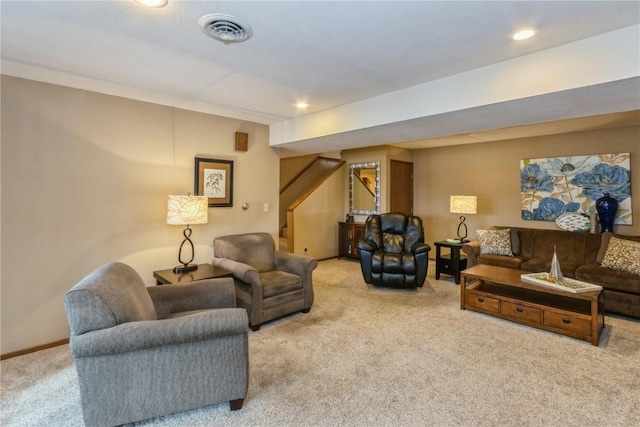 carpeted living area featuring recessed lighting, visible vents, baseboards, and stairway