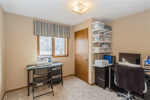 carpeted home office with baseboards