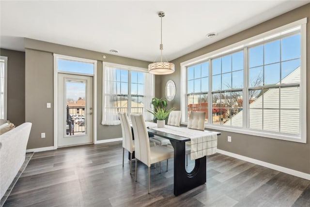 dining room with dark wood-style floors and baseboards