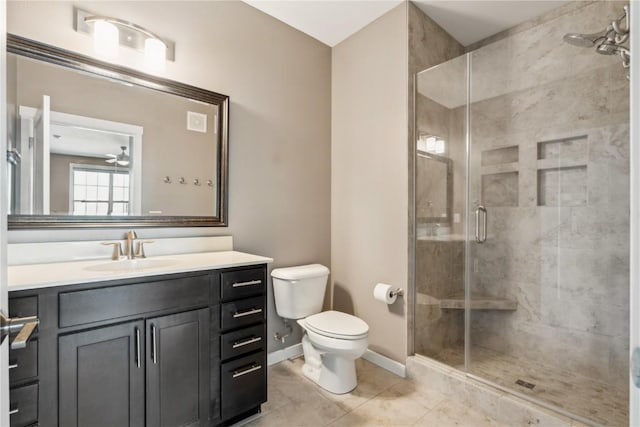 full bathroom featuring tile patterned flooring, toilet, vanity, baseboards, and a stall shower