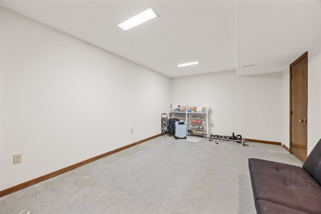 interior space with concrete floors and baseboards