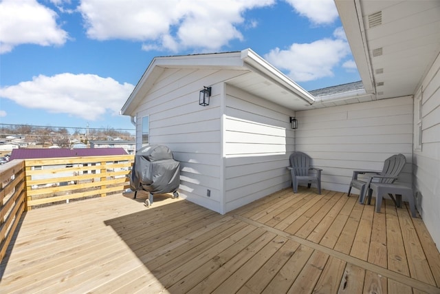 wooden terrace featuring area for grilling