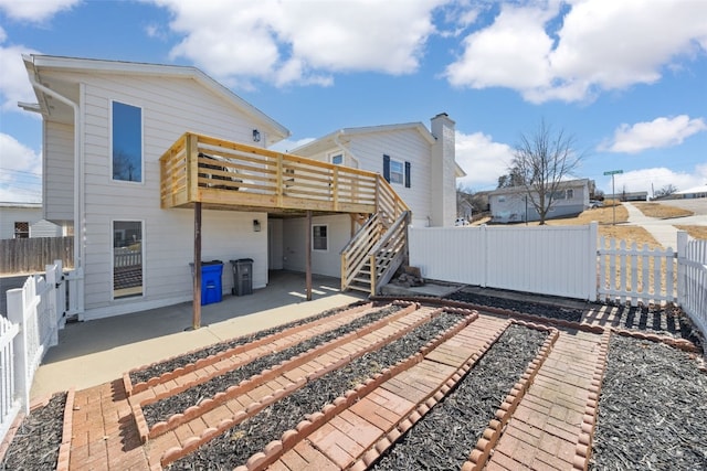 back of house with a patio, stairway, a fenced backyard, and a wooden deck