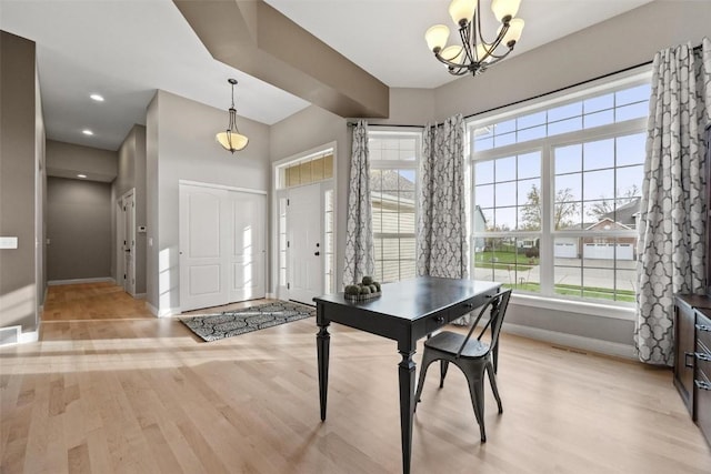 entrance foyer with recessed lighting, visible vents, light wood-style flooring, a chandelier, and baseboards