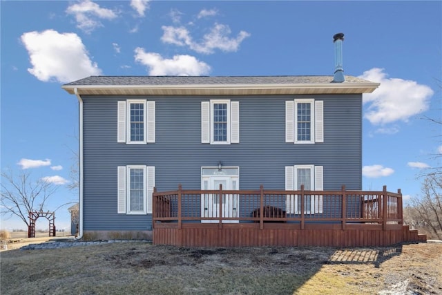 rear view of house with a wooden deck