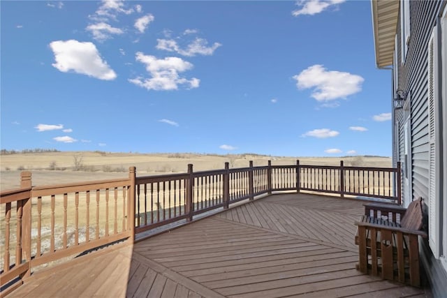 wooden terrace with a rural view