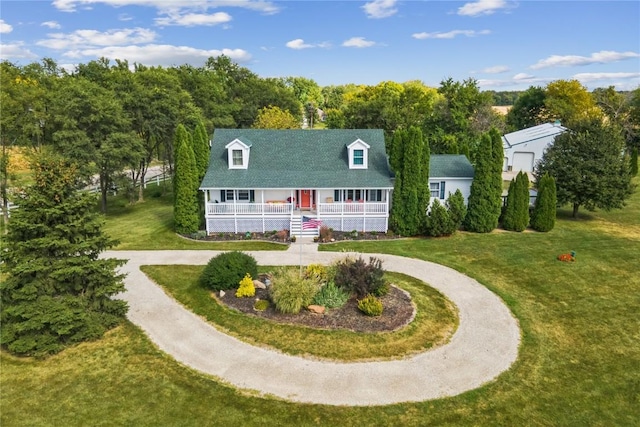 cape cod home with covered porch, curved driveway, and a front lawn