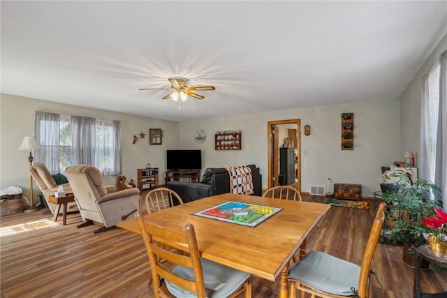 dining room with visible vents and wood finished floors