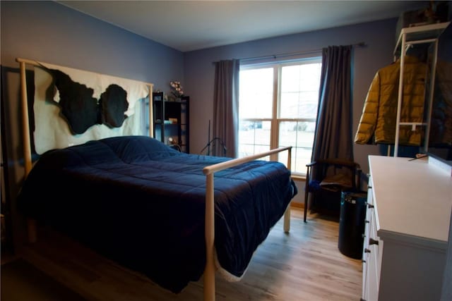 bedroom with light wood finished floors