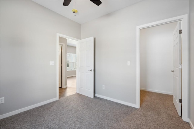 unfurnished bedroom featuring ceiling fan, carpet floors, and baseboards