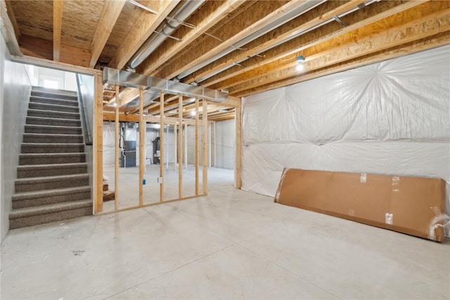 unfinished basement featuring stairway