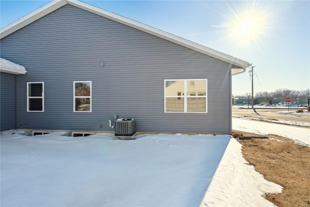 rear view of property featuring central AC