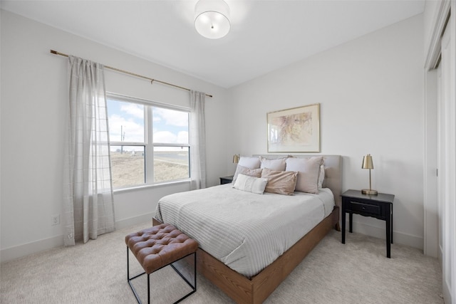 carpeted bedroom with baseboards