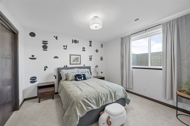 bedroom with light carpet, baseboards, and visible vents