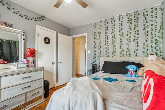 bedroom with a ceiling fan and wood finished floors