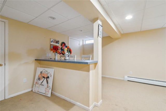 bar featuring carpet, a drop ceiling, and baseboard heating