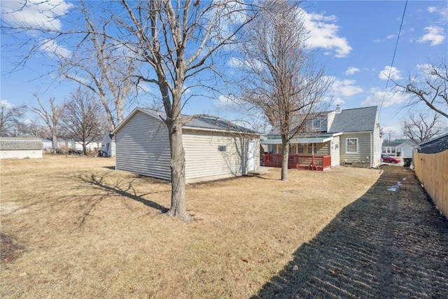 view of yard with an outbuilding and fence