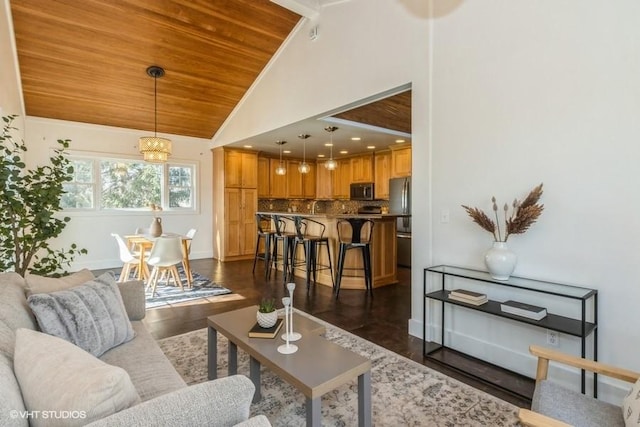 living room featuring a chandelier, high vaulted ceiling, wood ceiling, baseboards, and dark wood finished floors