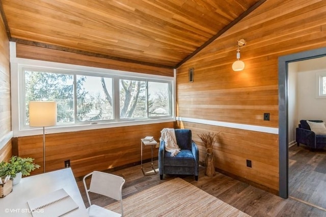 living area featuring wood ceiling, wooden walls, vaulted ceiling, and wood finished floors