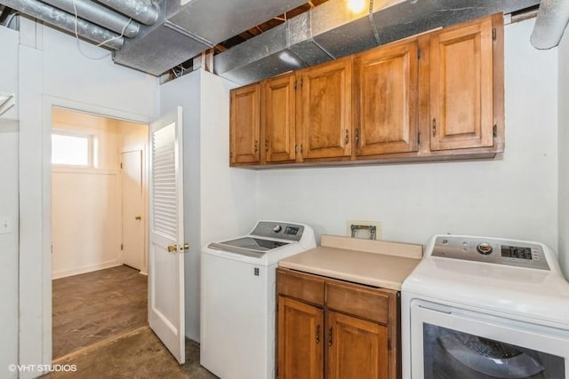 laundry room with cabinet space and washing machine and clothes dryer