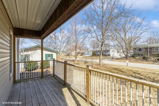 wooden deck with a residential view