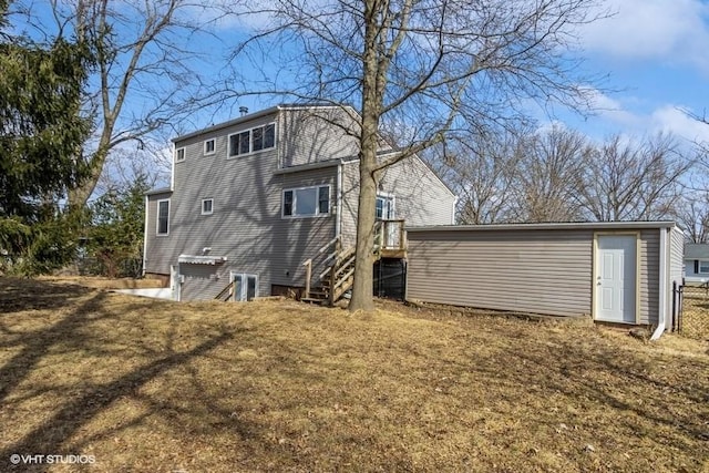 back of house featuring a yard