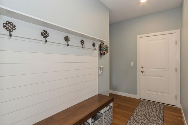 mudroom featuring baseboards and wood finished floors