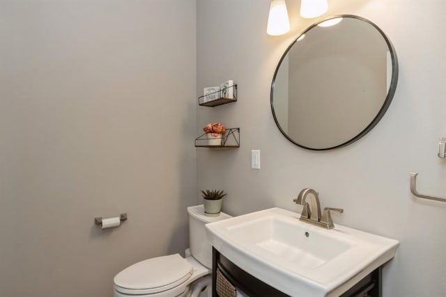 half bath with vanity and toilet