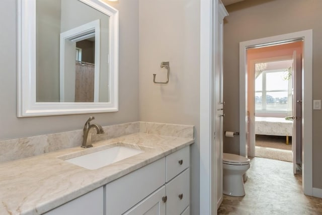 bathroom featuring toilet and vanity