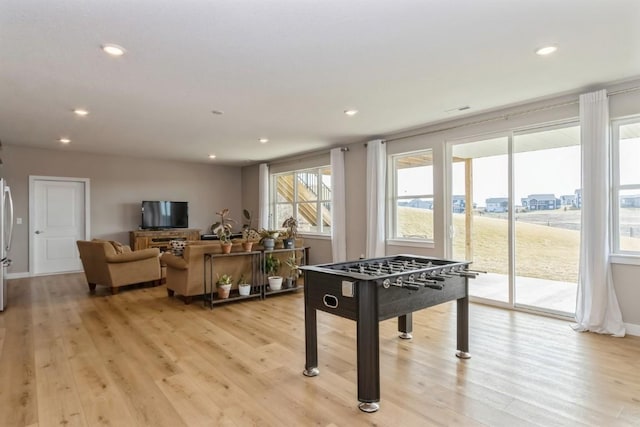 game room with light wood-style floors, baseboards, and recessed lighting