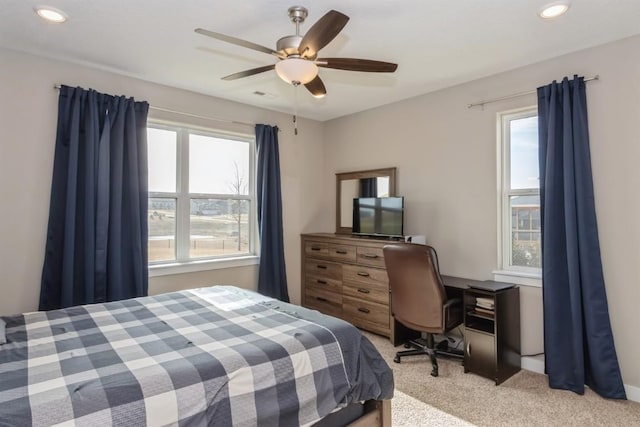 bedroom featuring light carpet, a ceiling fan, visible vents, and recessed lighting