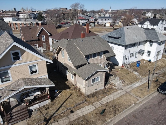 birds eye view of property with a residential view