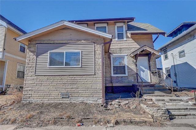 view of front of home with stone siding