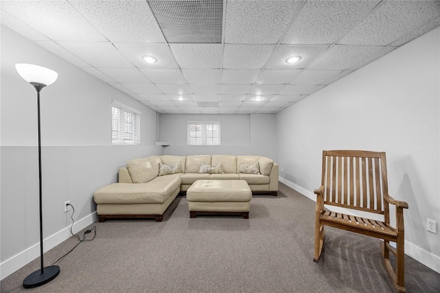 carpeted living room featuring a drop ceiling, recessed lighting, visible vents, and baseboards