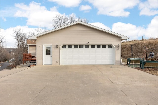 garage with concrete driveway