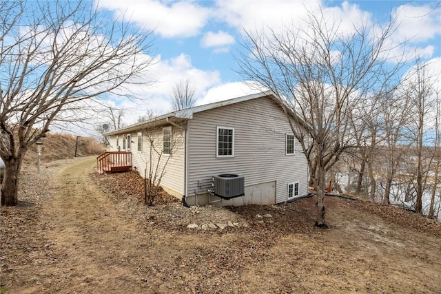 view of side of home featuring central AC unit