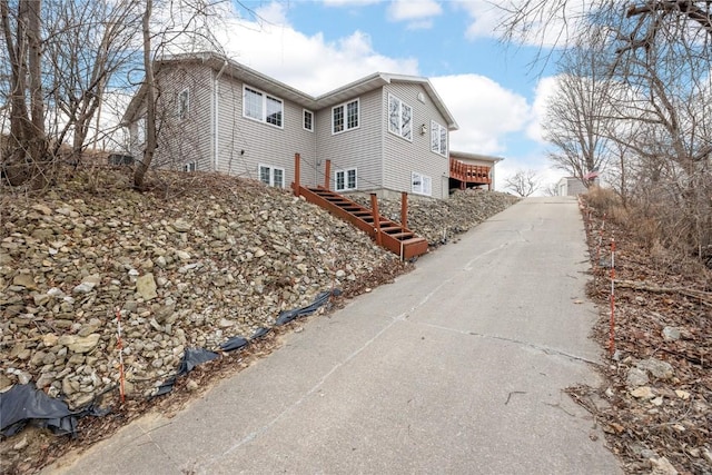 view of home's exterior featuring stairs